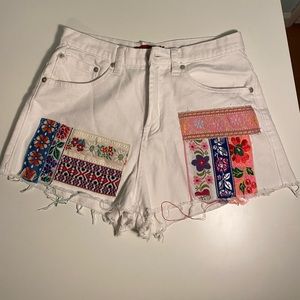 Signature 8 embroidered distressed denim jeans